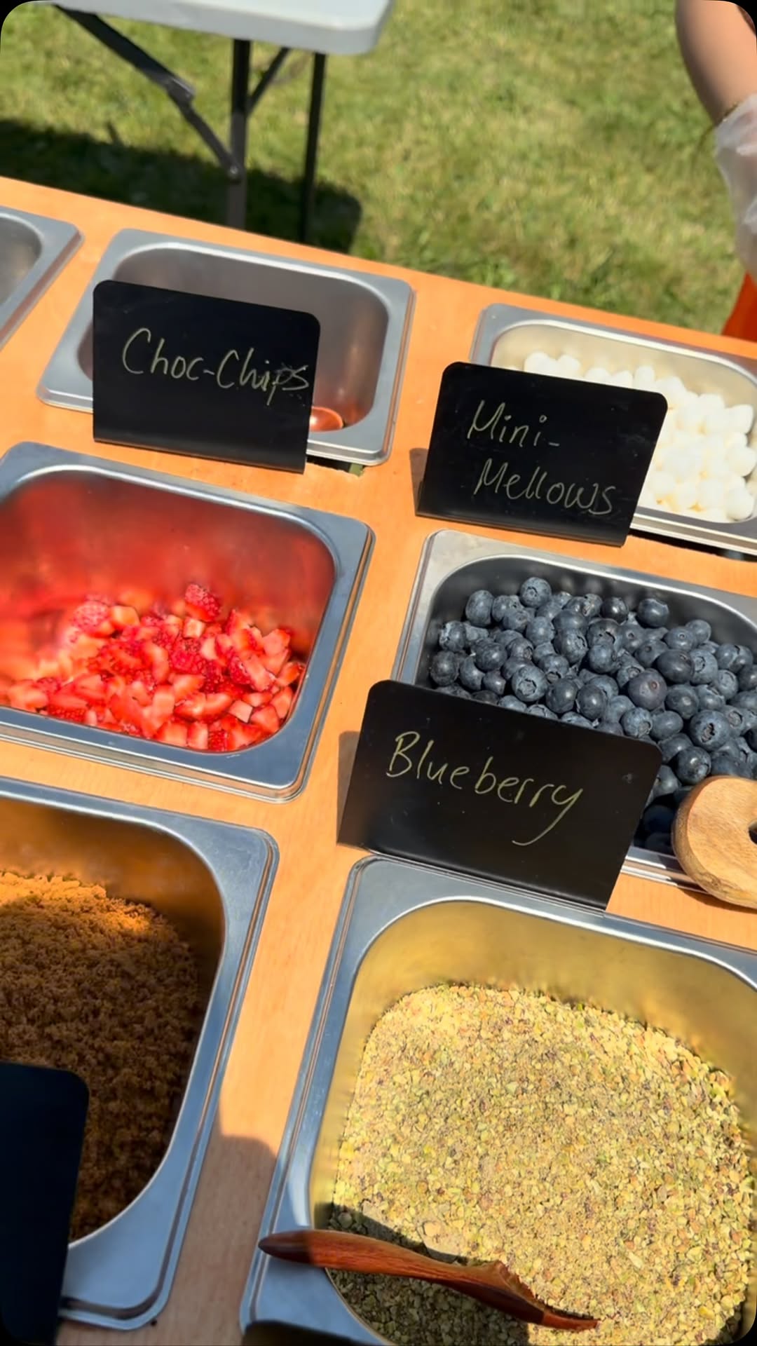 Fresh berries and sweet toppings at the 249 Bitez dessert table.